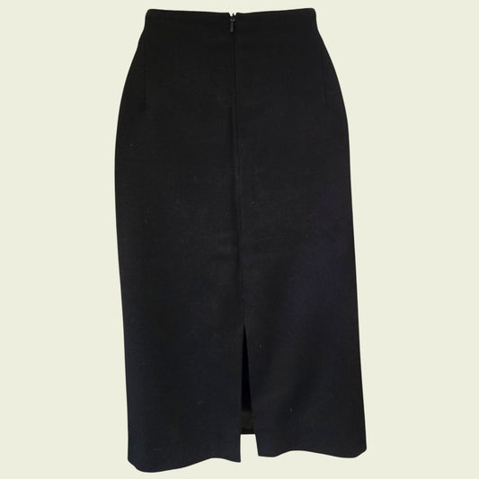 Black pencil skirt on a beige background