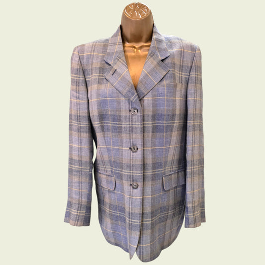 Plaid blazer on a mannequin against a light background