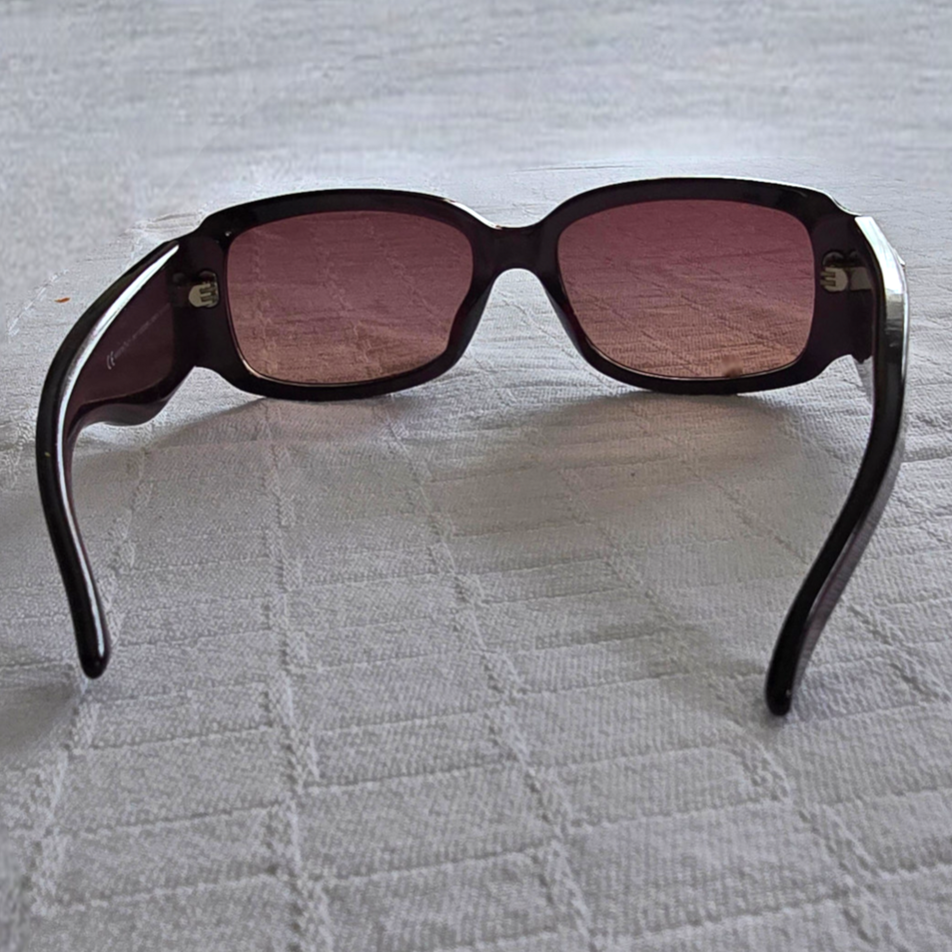 Mauve sunglasses on a white background
