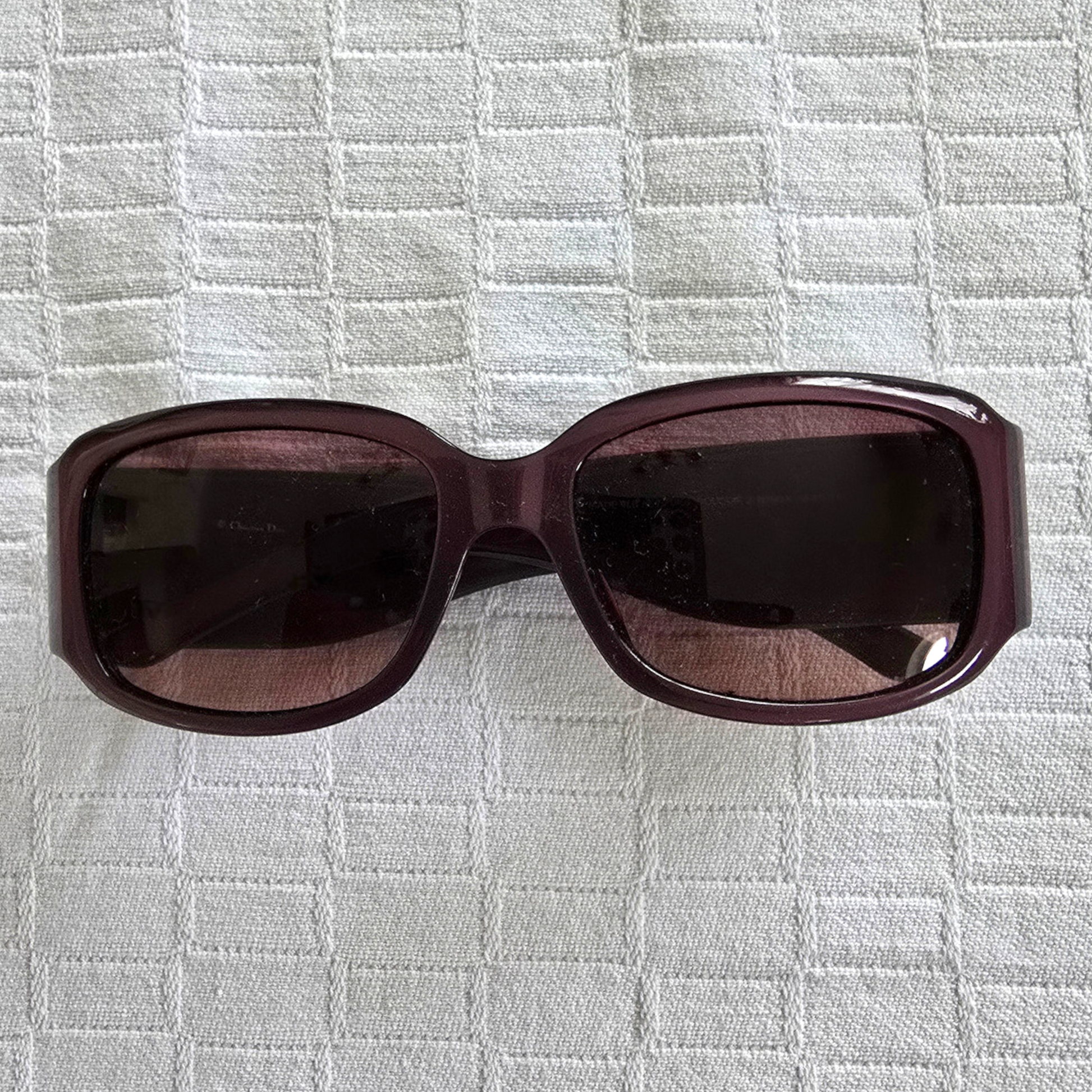 Mauve sunglasses on a white background
