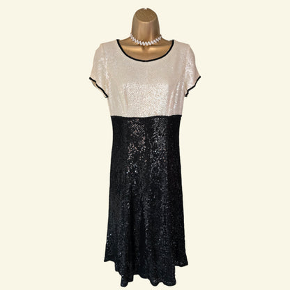 Two-tone sequin dress on a mannequin with a white background