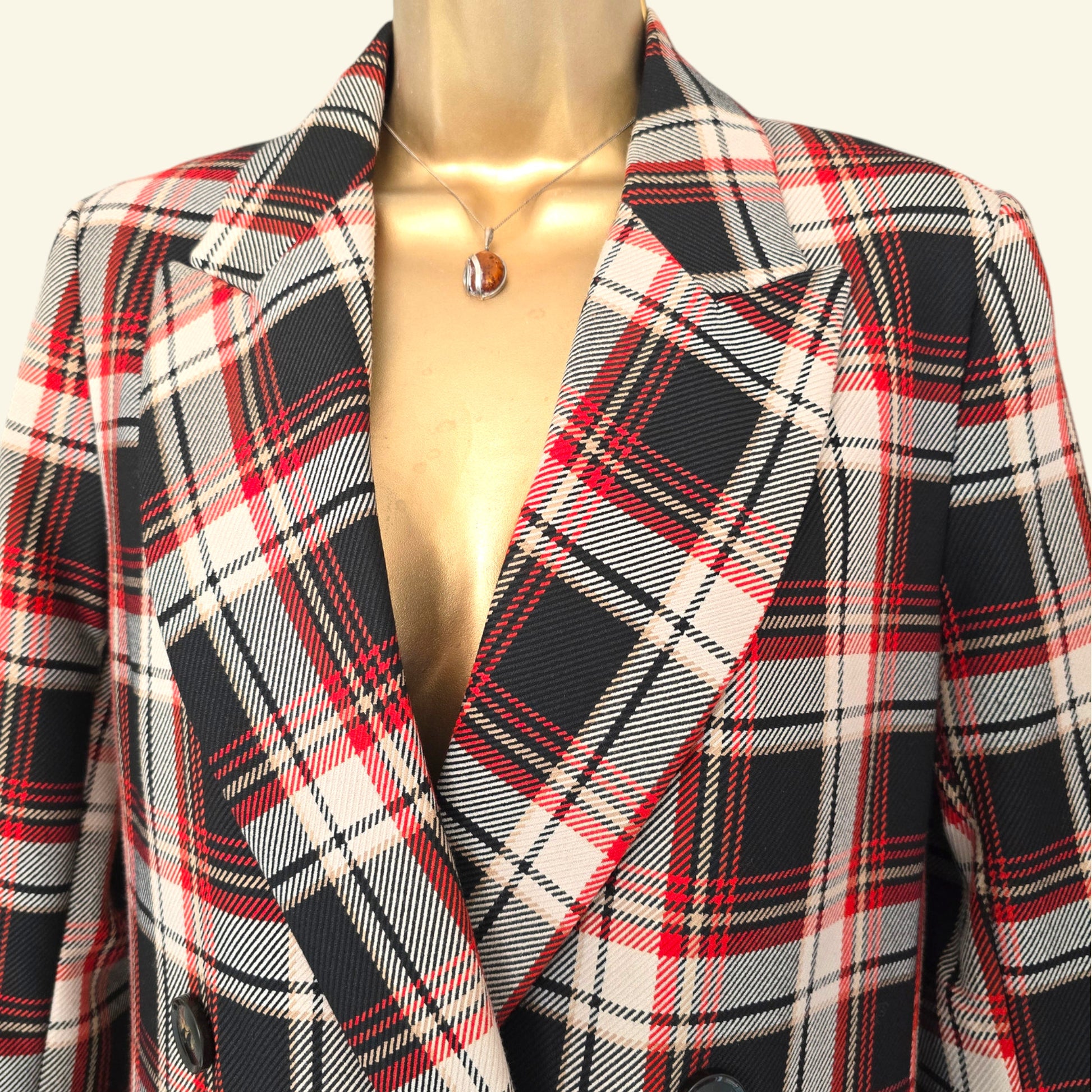Plaid coat on a mannequin with a white background