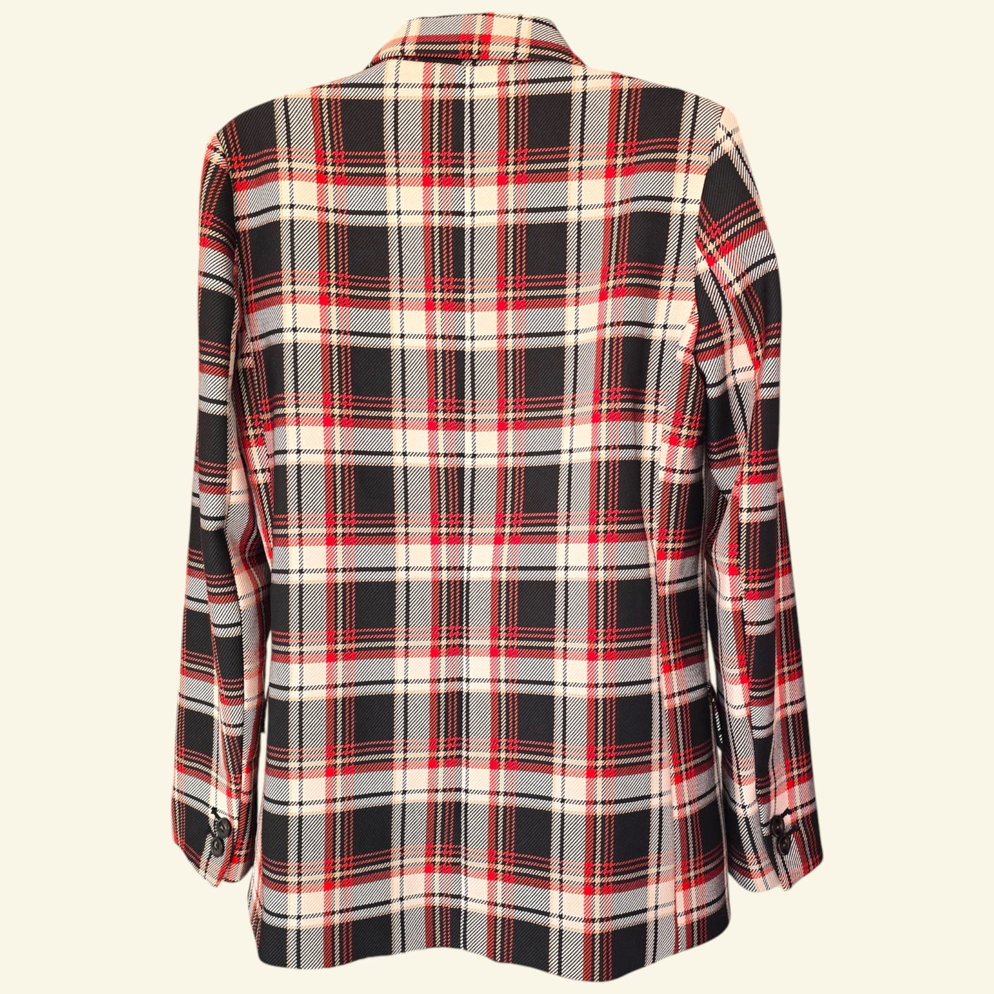 Plaid jacket with red, black, and white pattern on a beige background