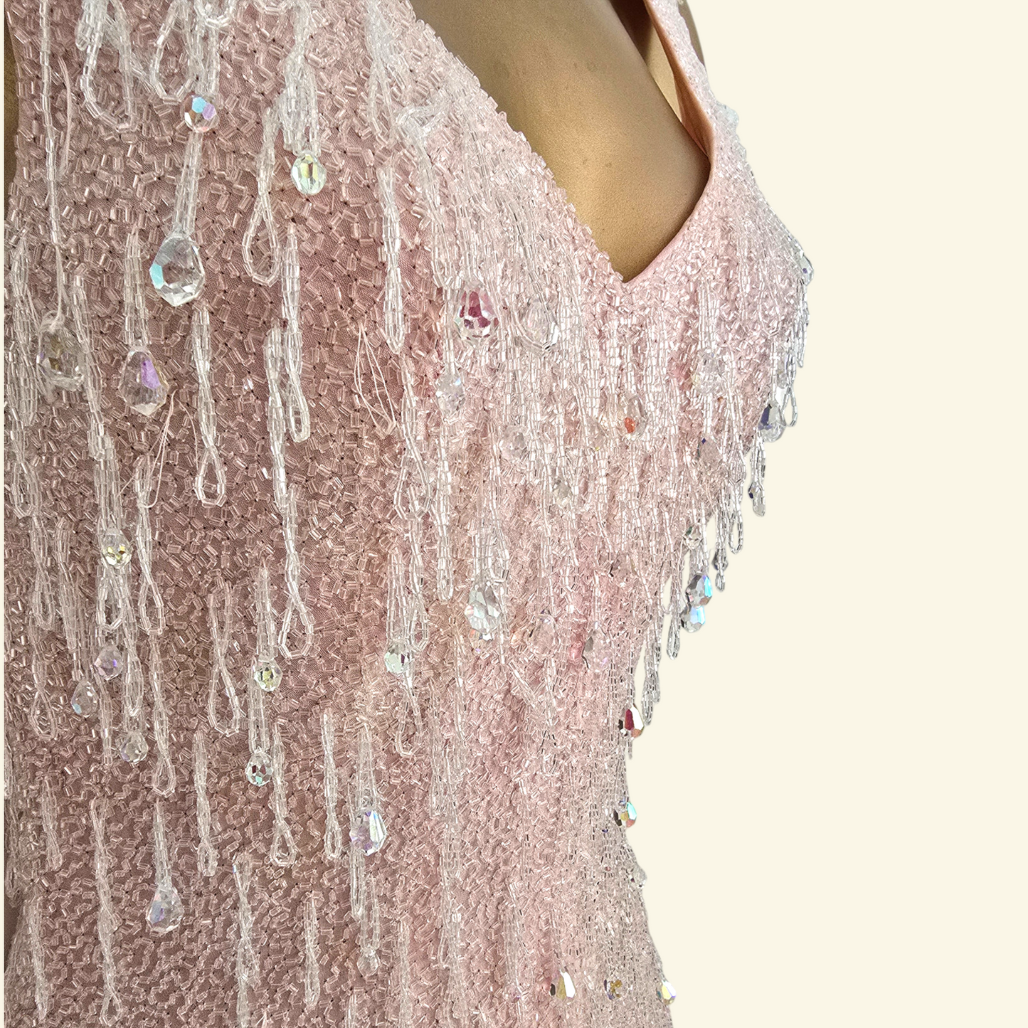 Close up of bead detail on pink dress 