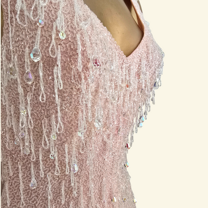 Close up of bead detail on pink dress 