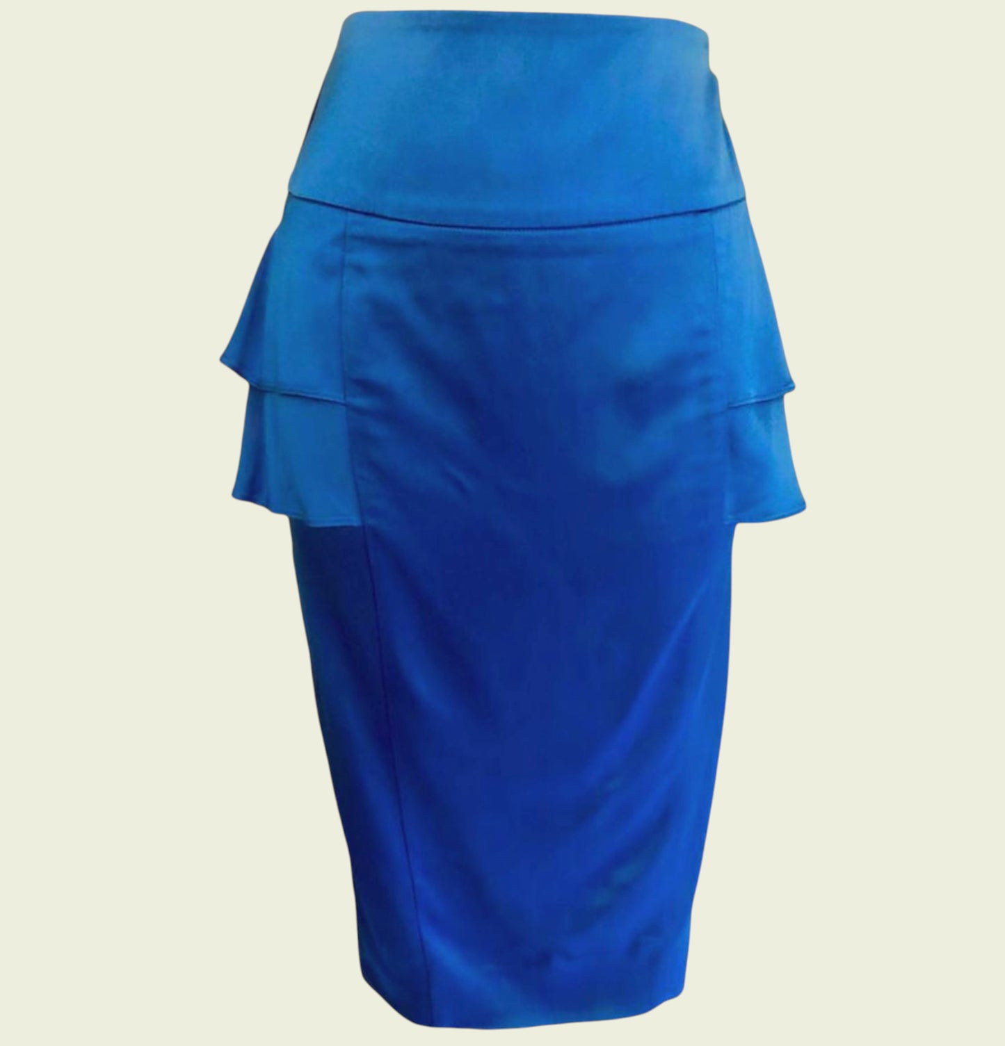 Blue skirt with ruffled layers on a beige background