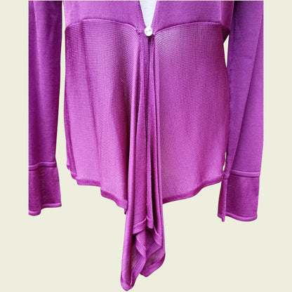 Fuchsia cardigan on a beige background