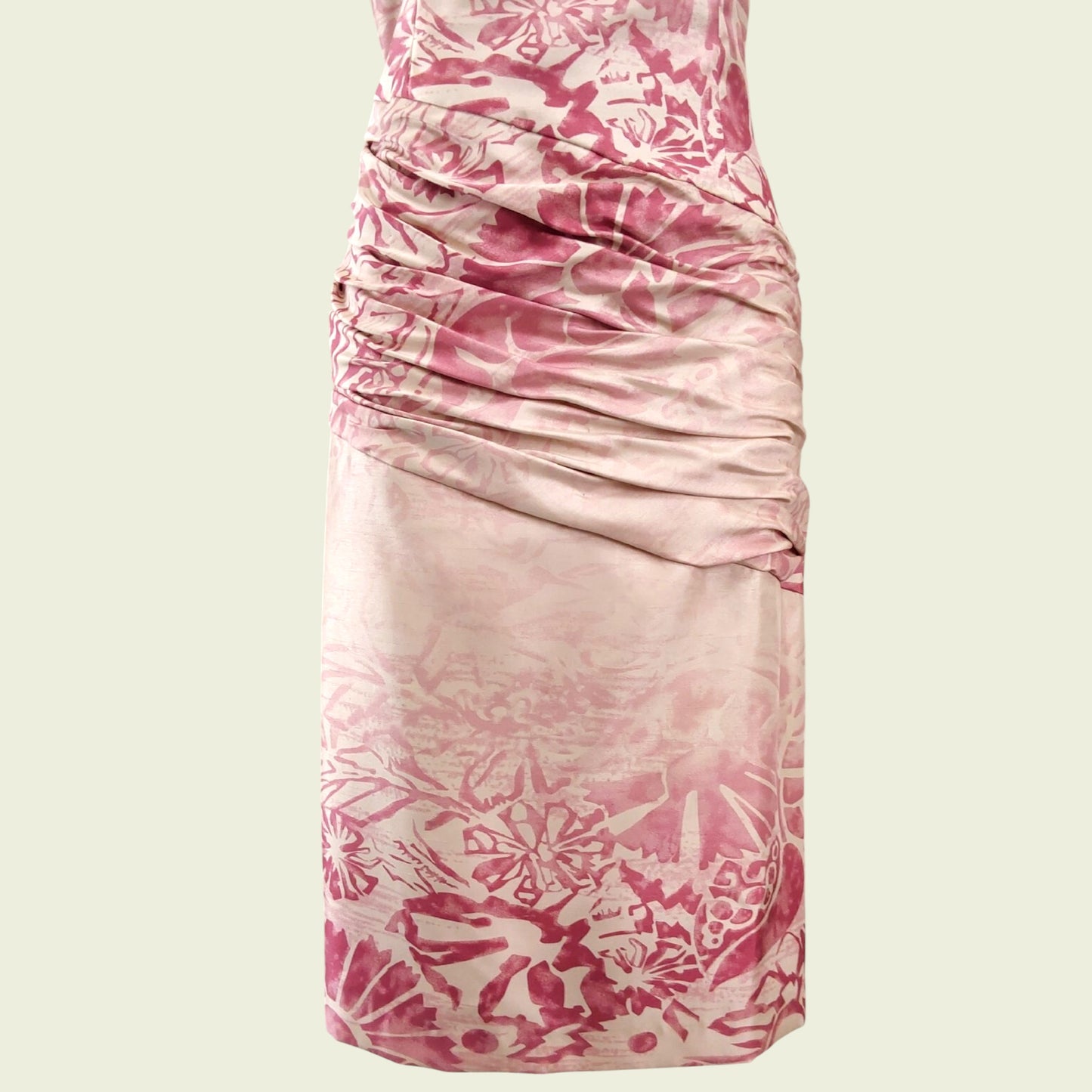 Pink and cream dress on beige background