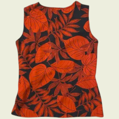 Sleeveless top with red leaf pattern on a beige background
