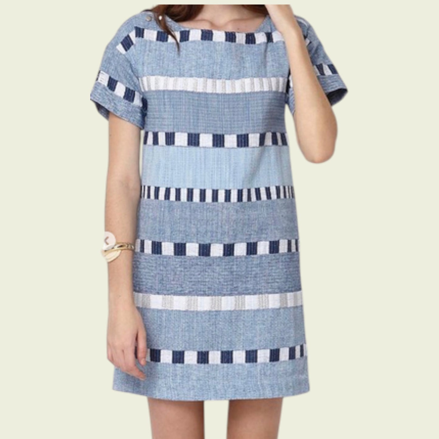 Blue and white striped dress on a plain background