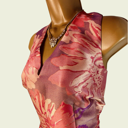 Mannequin wearing a floral dress with a beige background