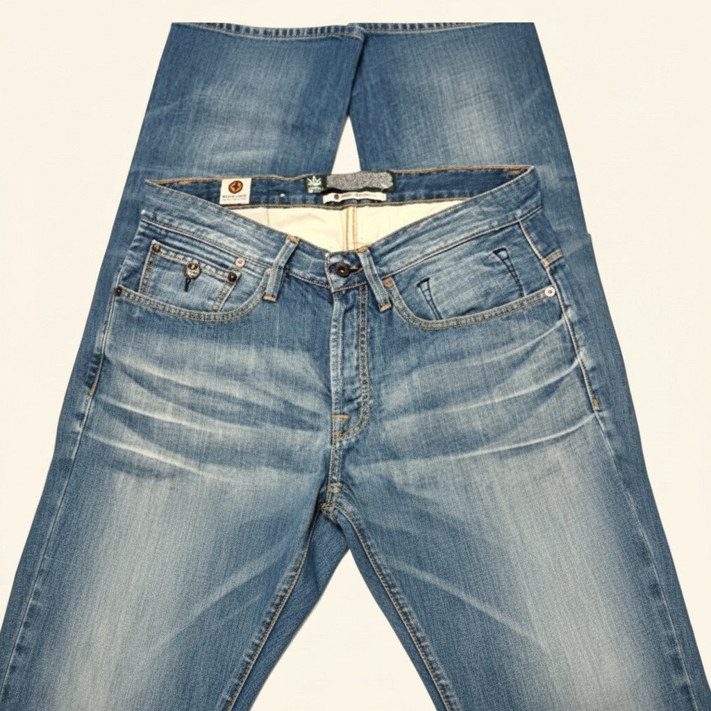 Light blue denim jeans with a faded wash, laid flat against a light off-white background.