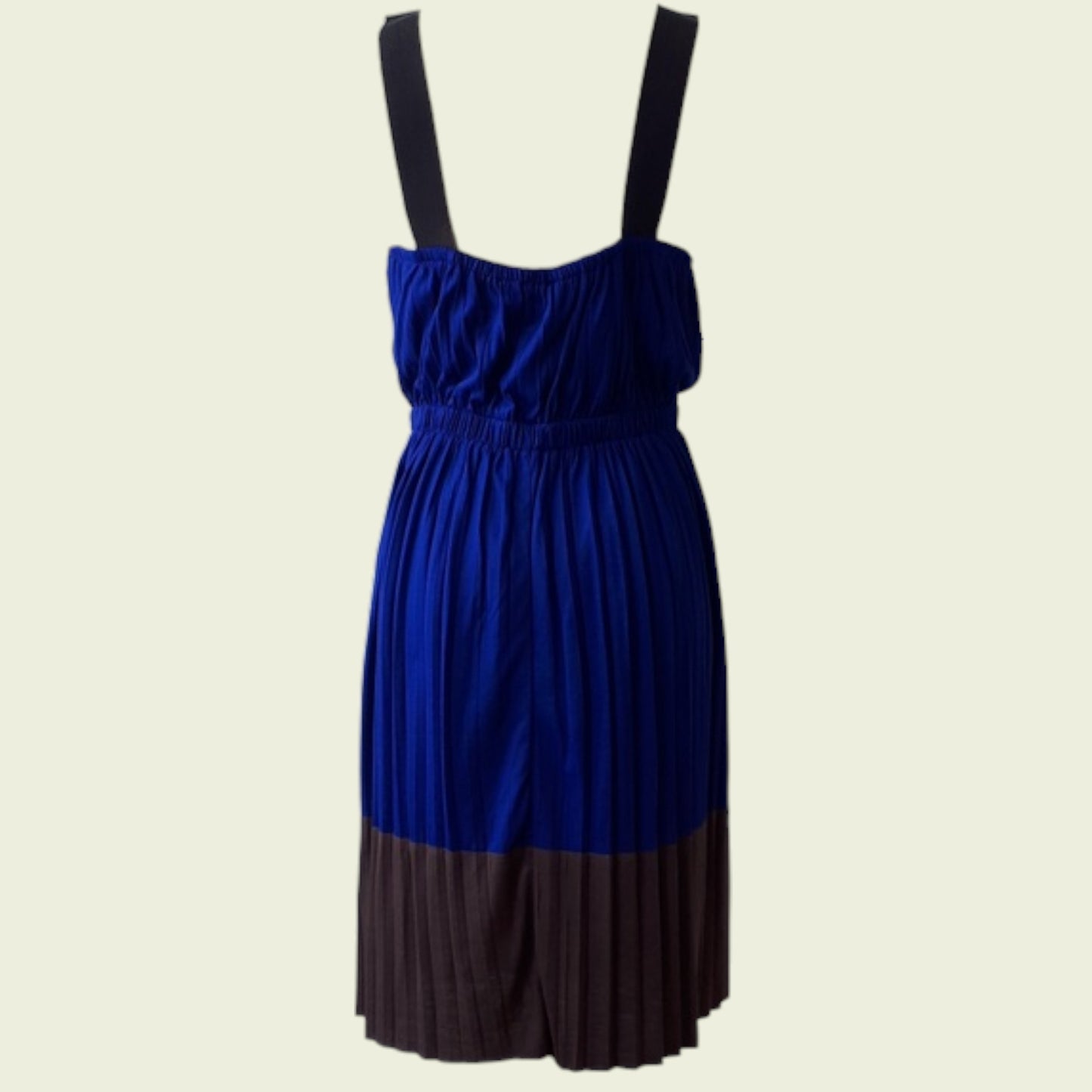 Two-tone blue and brown dress on a beige background