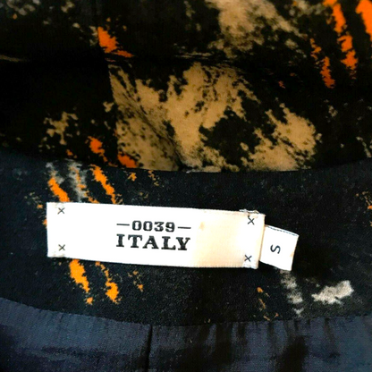 Textile with a label indicating '0039 ITALY' on a multicolored background