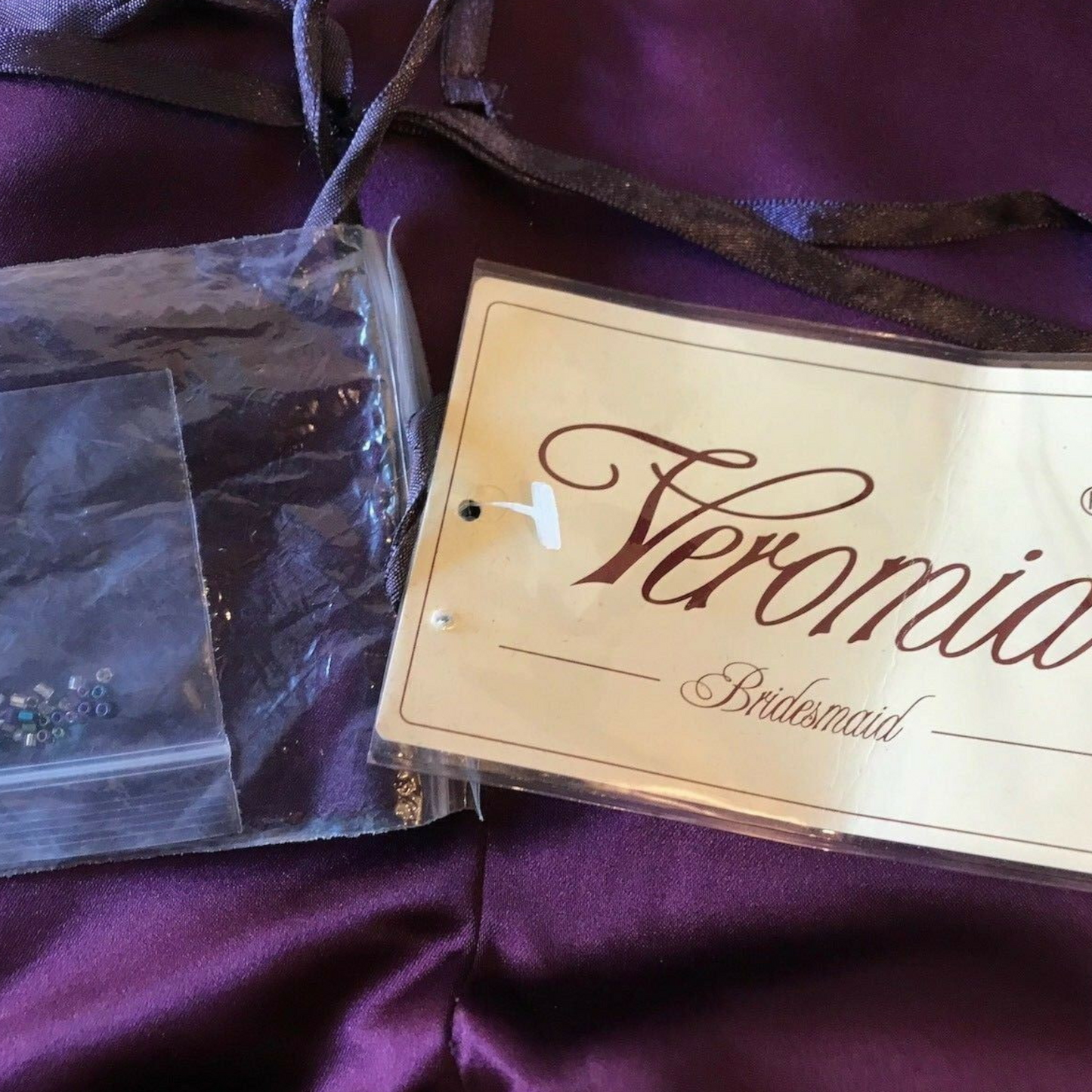 Veromia Bridesmaid label on a purple fabric background