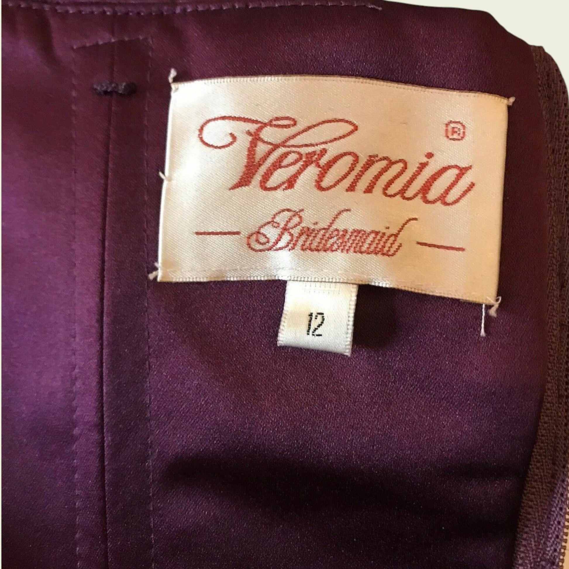 Label on a purple garment with 'Veromia Bridesmaid' text
