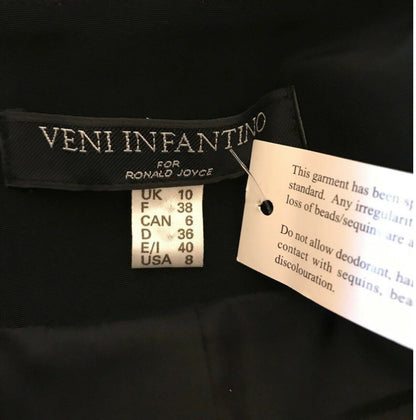 Veni Infantino label on a garment with size chart and care instructions.