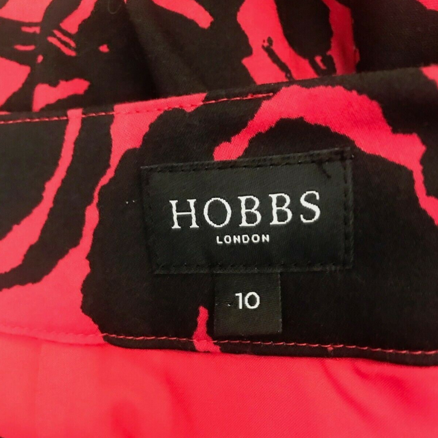 Hobbs London label on a red and black patterned fabric