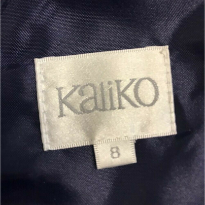 Kalliko label on a dark fabric background
