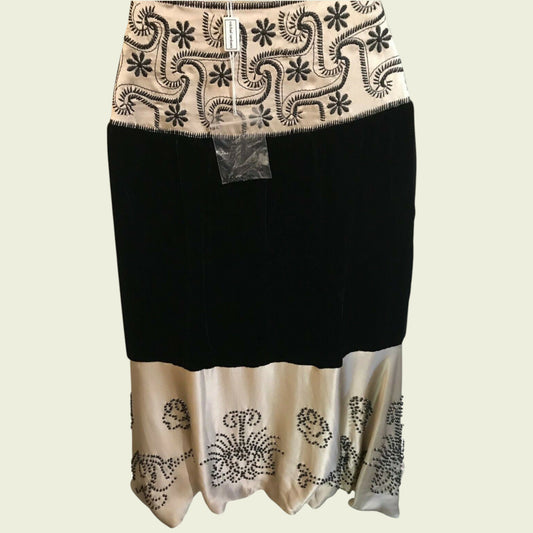 Black and cream embroidered skirt on a beige background
