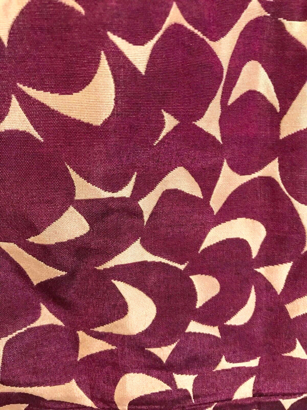 Patterned fabric with purple and beige design