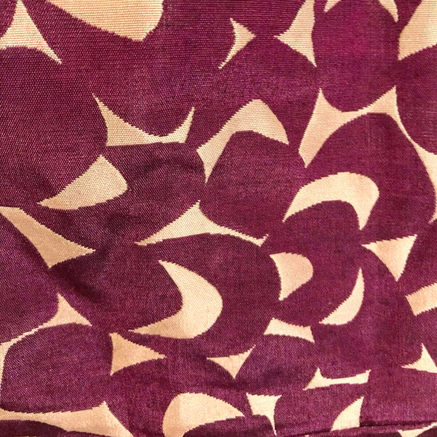 Patterned fabric with purple and beige shapes