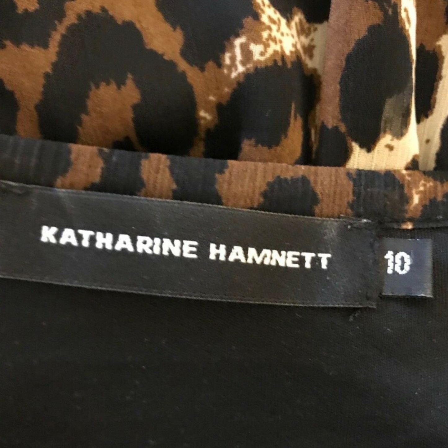 Animal print chiffon dress with Katharine Hamnett label on black background