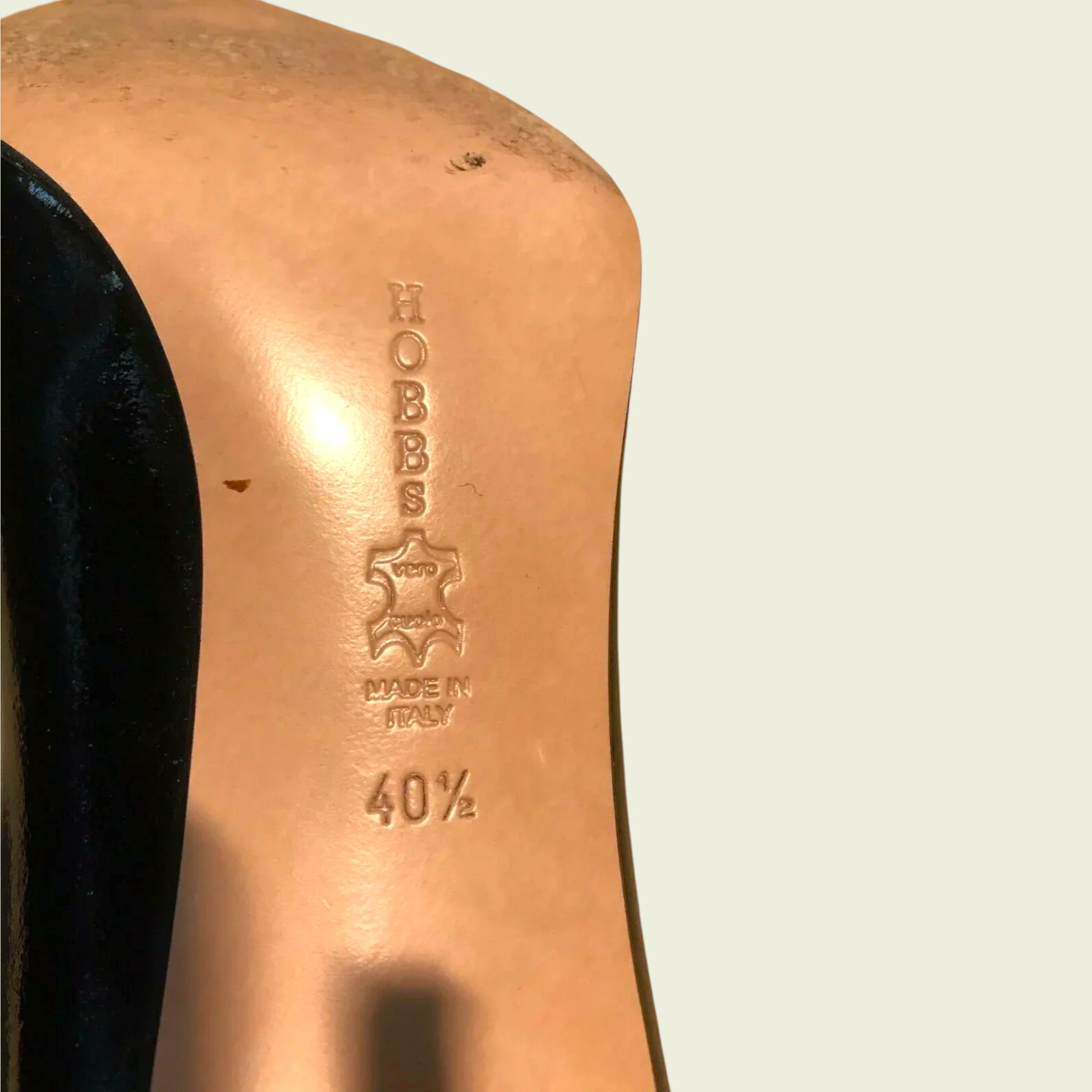 Close-up of a shoe with 'Hobbs' branding on a light background