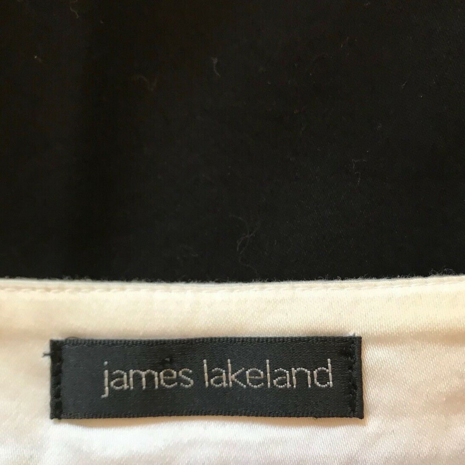 Clothing label with JAMES LAKELAND on white background
