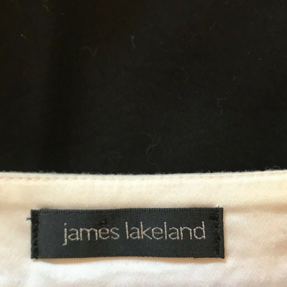 Clothing label with JAMES LAKELAND on white background