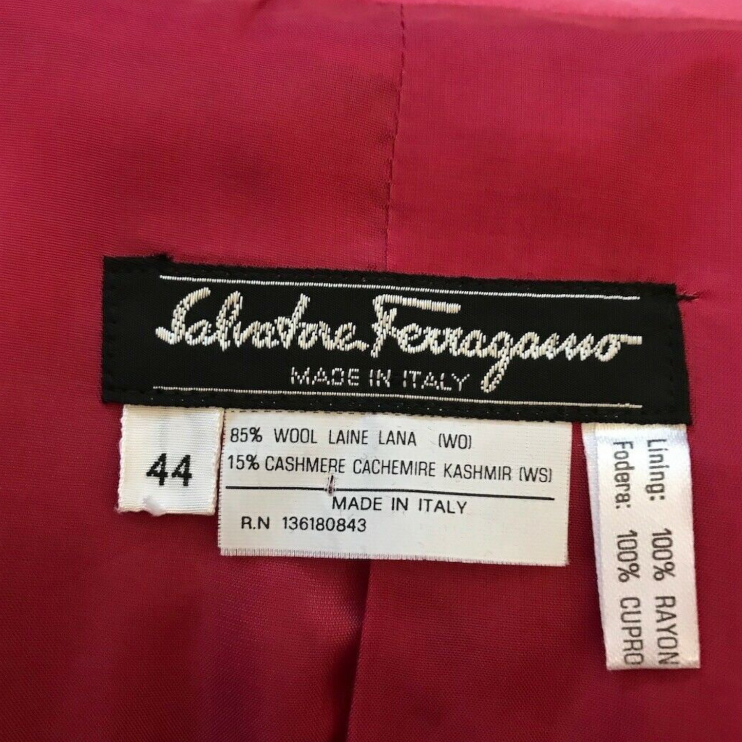 Salvatore Ferragamo label on a red fabric background