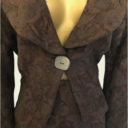 Brown textured coat on a mannequin with a plain background