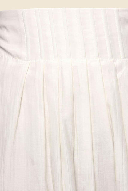 Close-up of a cream fabric with subtle texture
