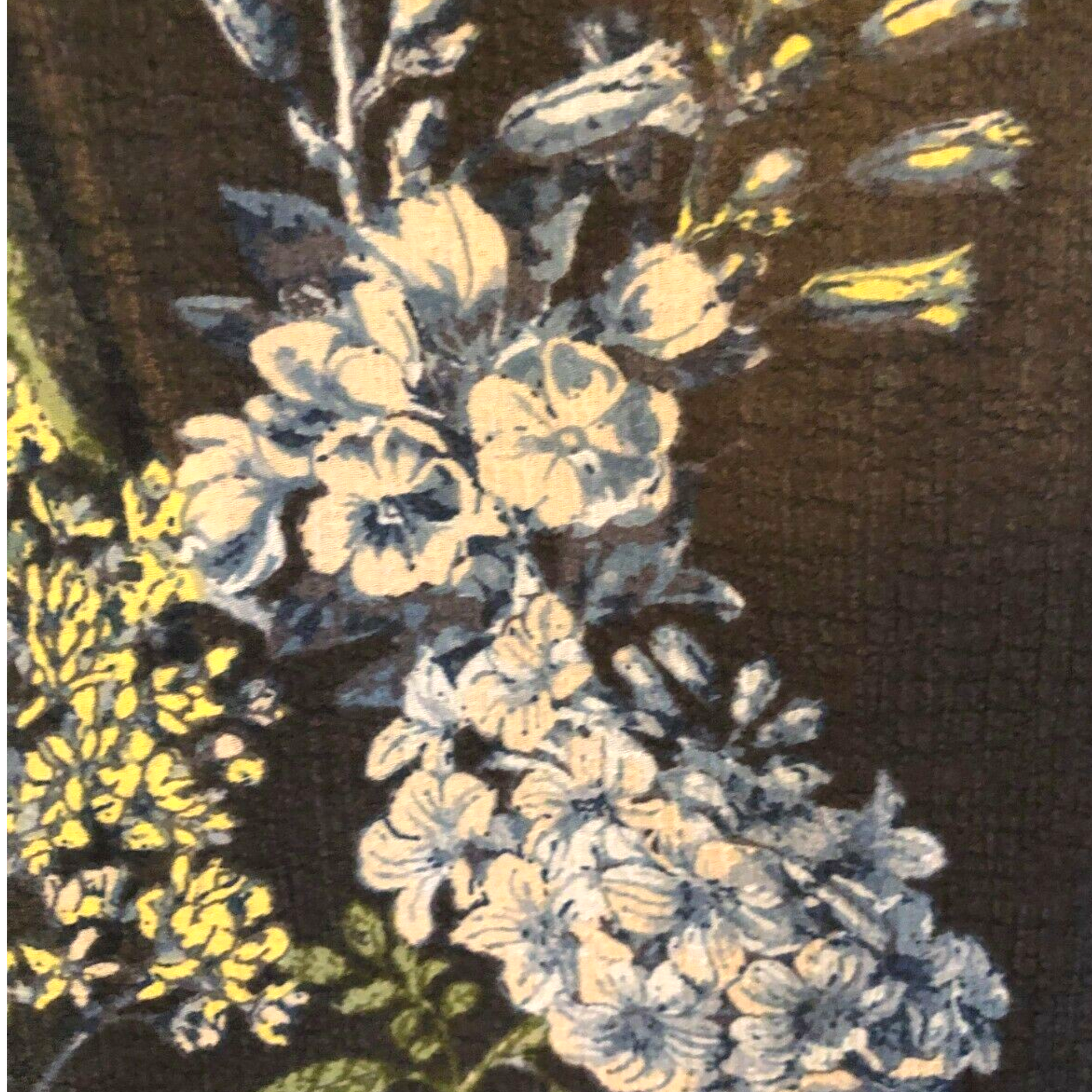 Close-up of a floral pattern with white and yellow flowers on a dark background