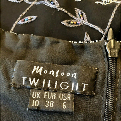 Label on a garment with 'Monsoon Twilight' branding and size information.