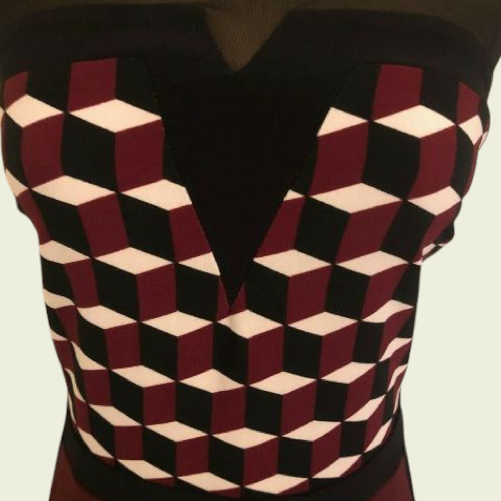 Geometric patterned dress with a V-neck design on a beige background