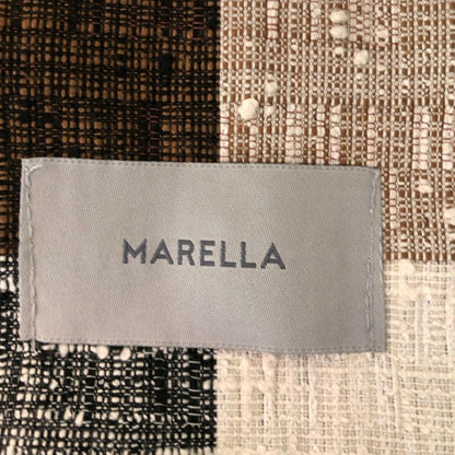 MARELLA label on a textured fabric background