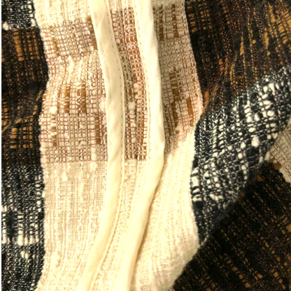 Close-up of textured fabric with a focus on pattern and color.