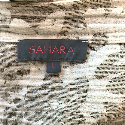 Floral fabric with a label reading 'SAHARA L' in red text on a black background.