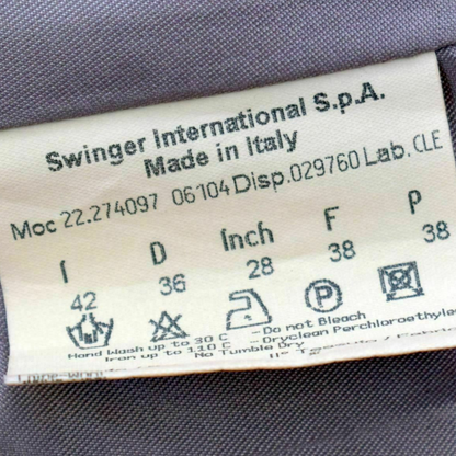 Fabric tag with 'Swinger International S.p.A.' branding and size information on a gray fabric background.
