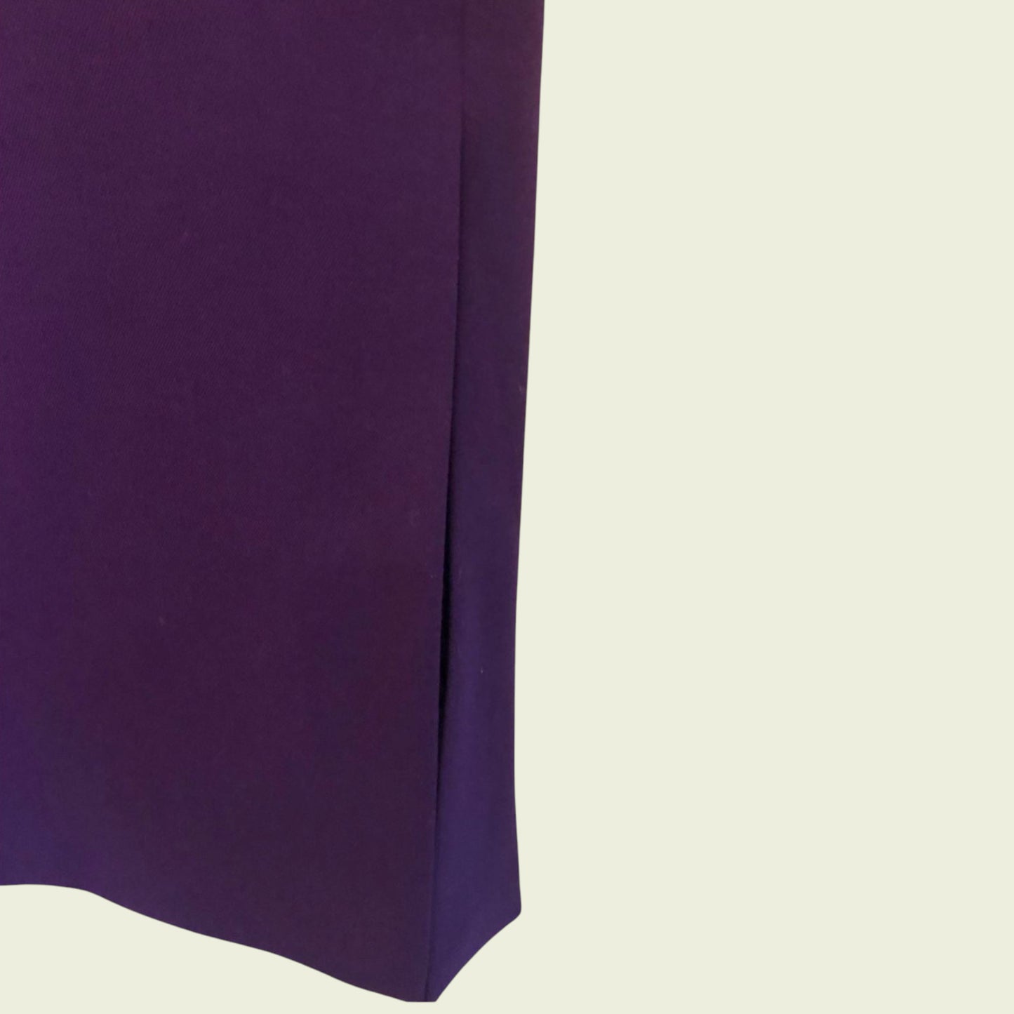 Purple fabric skirt on a beige background