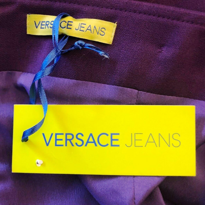 Purple garment with Versace Jeans label on a yellow tag