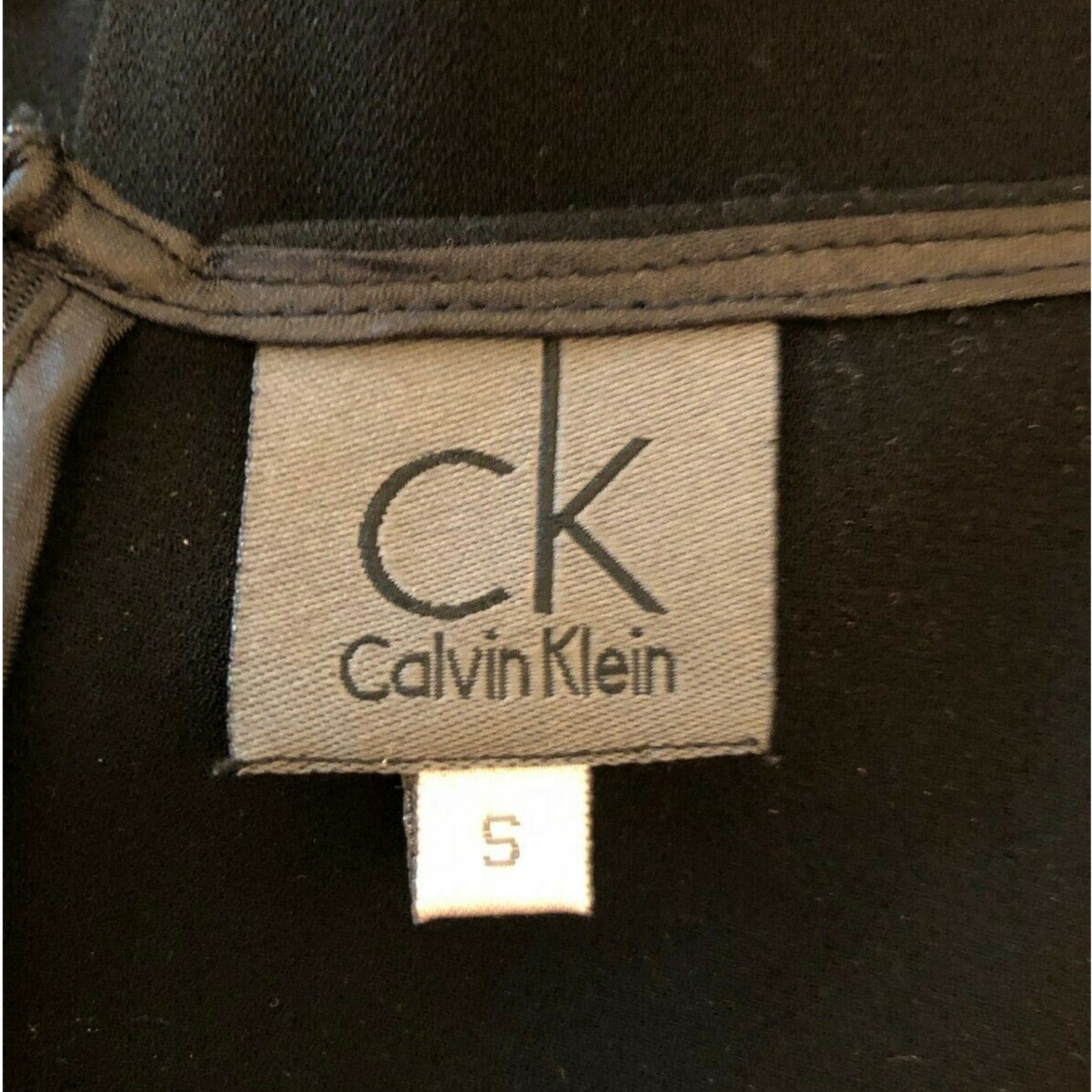 Calvin Klein label on a black garment