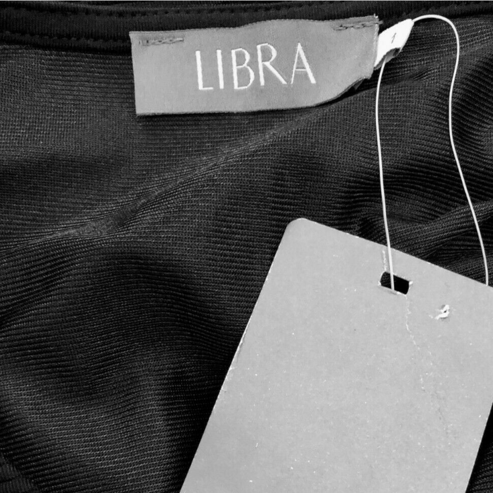 Navy fabric with a 'Libra' label and a gray tag.