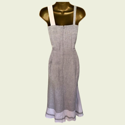 Gray apron on a mannequin against a light green background