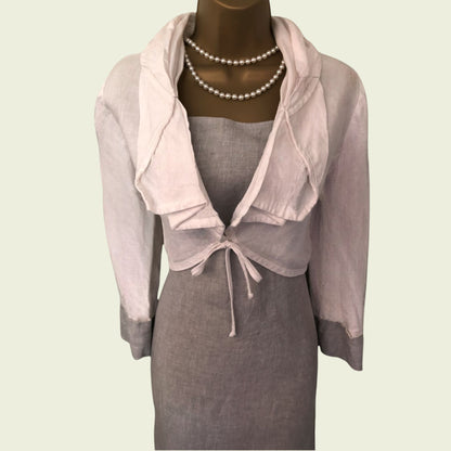 Mannequin wearing a gray dress with a matching bolero on a light background