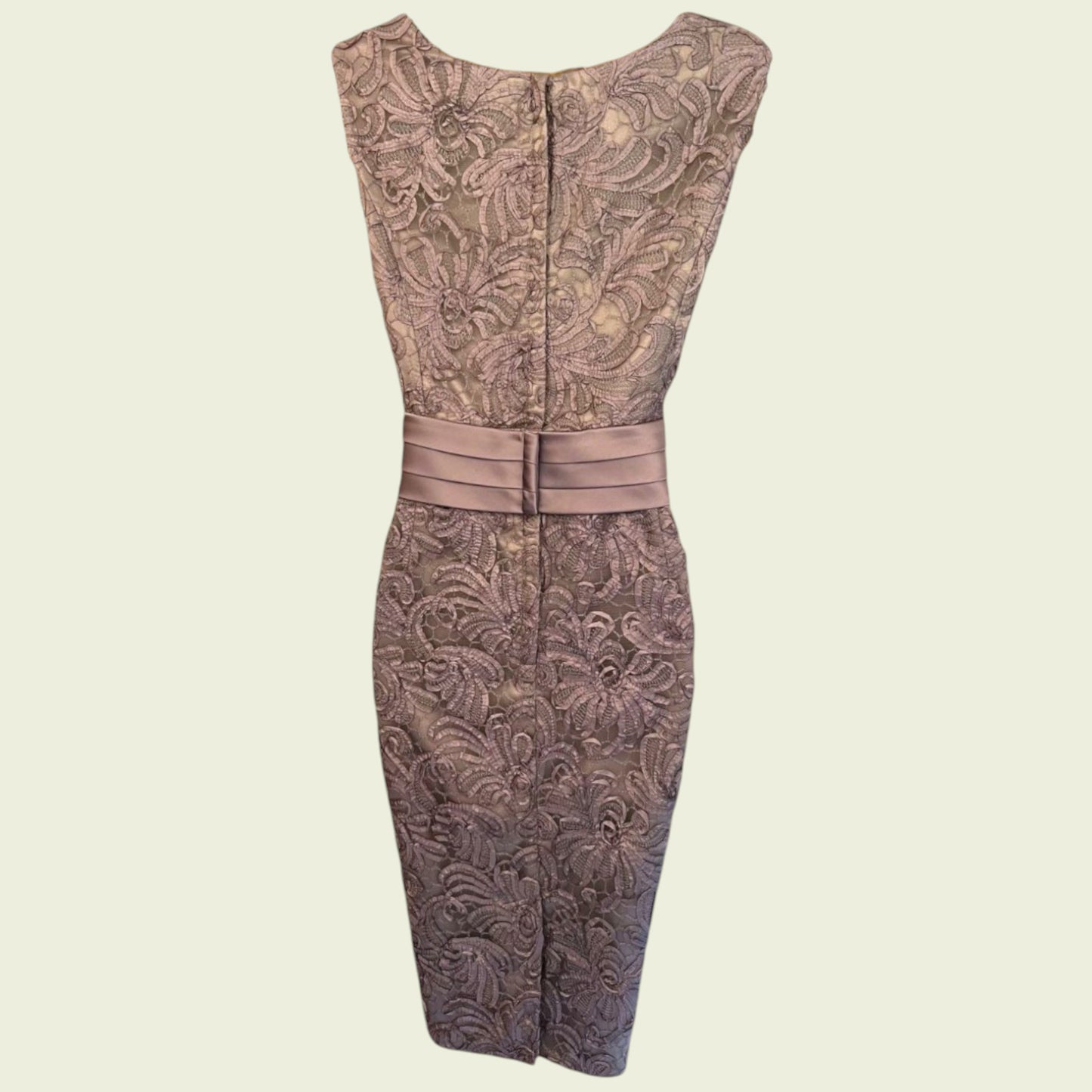 Patterned dress with a belt on a beige background