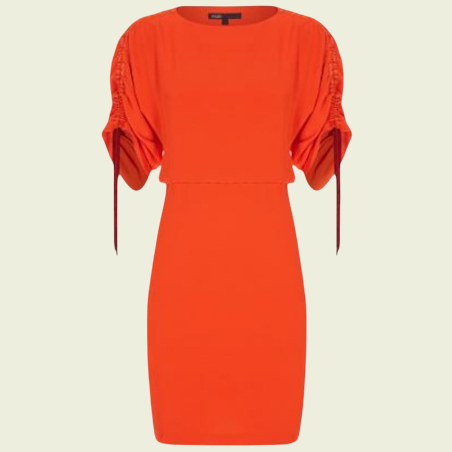 Red dress with ruched sleeves on a beige background