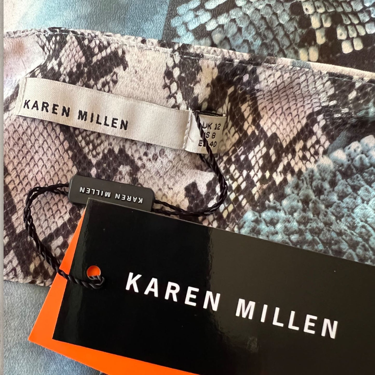 Patterned fabric with a Karen Millen label and tag.