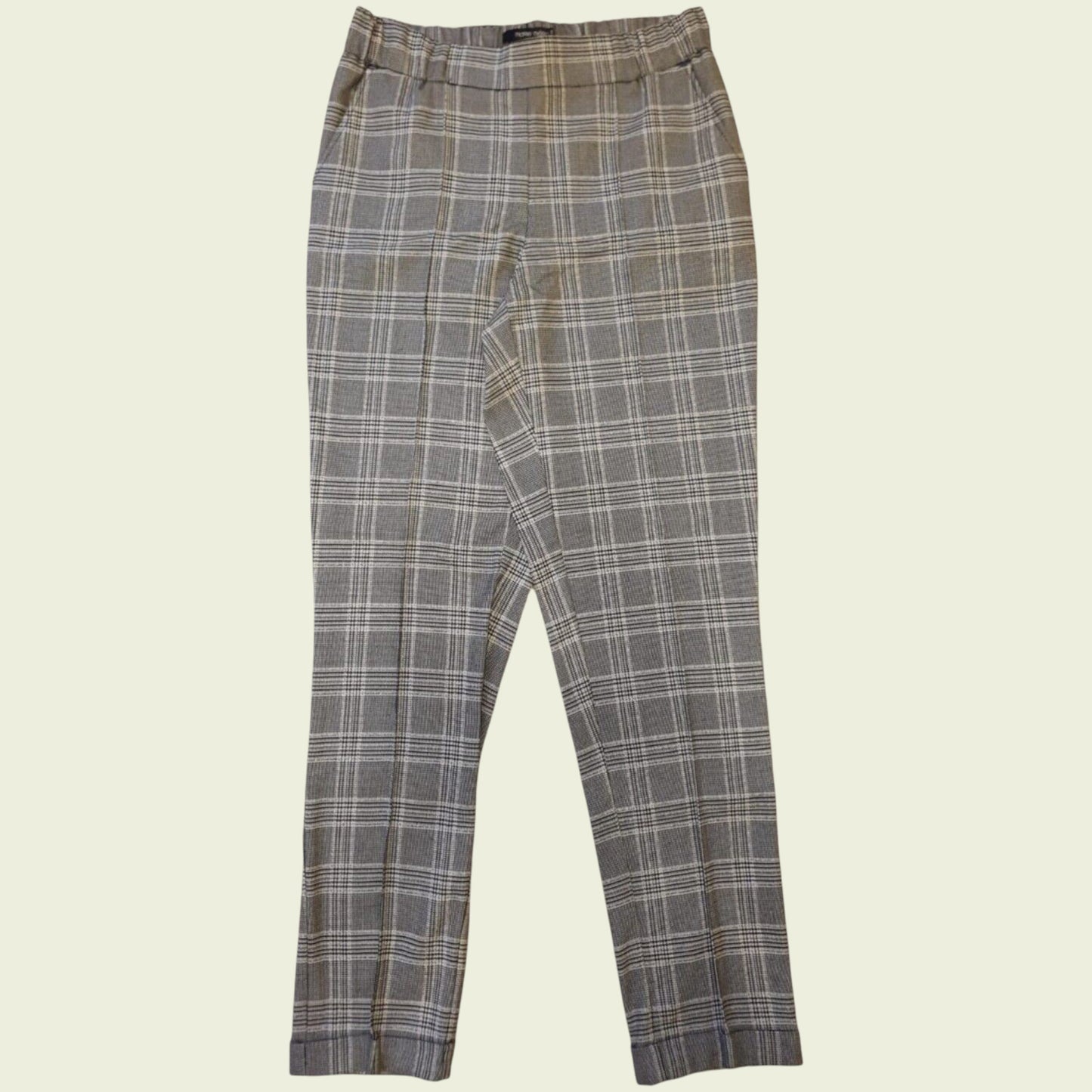 Plaid pants on a beige background